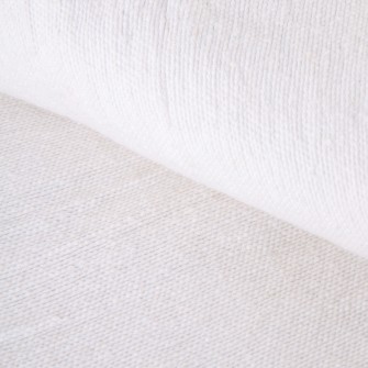 Kremowy pled bawełniany ręcznie tkany. Narzuta w kolorze ecru z ozdobnymi chwostami. Naturalny dodatek do jasnych wnętrz.